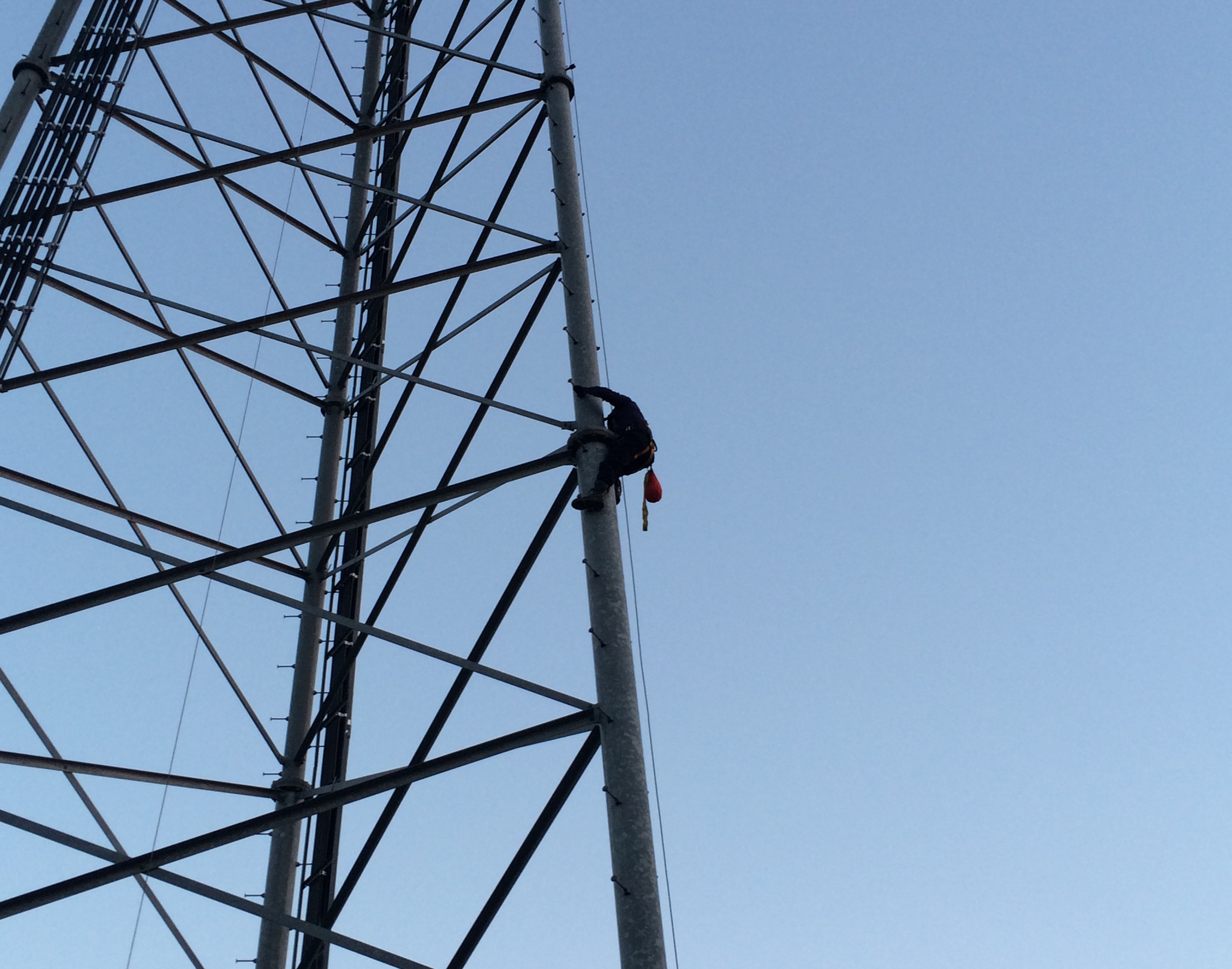 Man climbing a tall tower