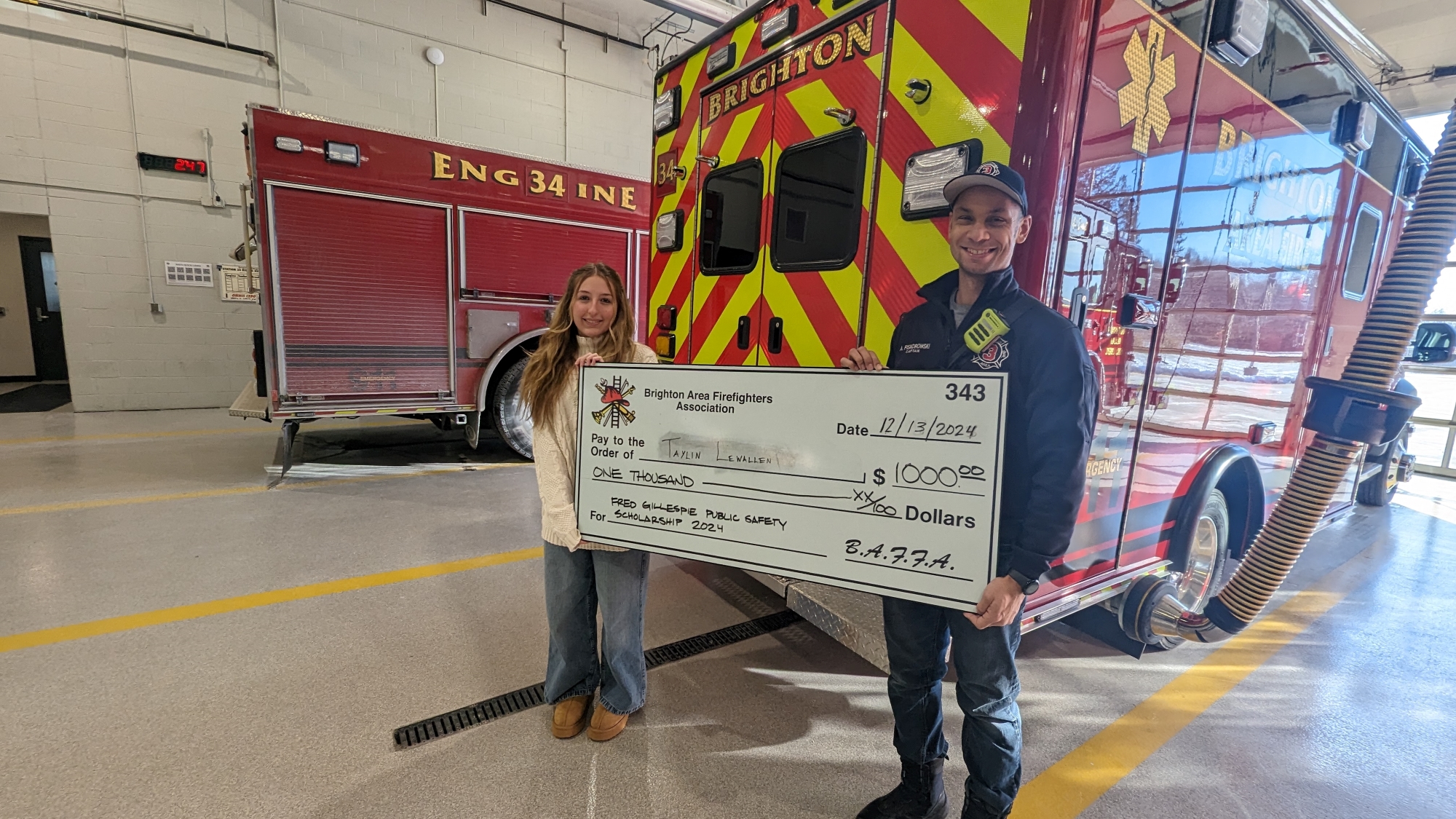 Taylin Lewallin receiving the Brighton Area Firefighters Association Fred Gillespie Public Safety Scholarship 2024