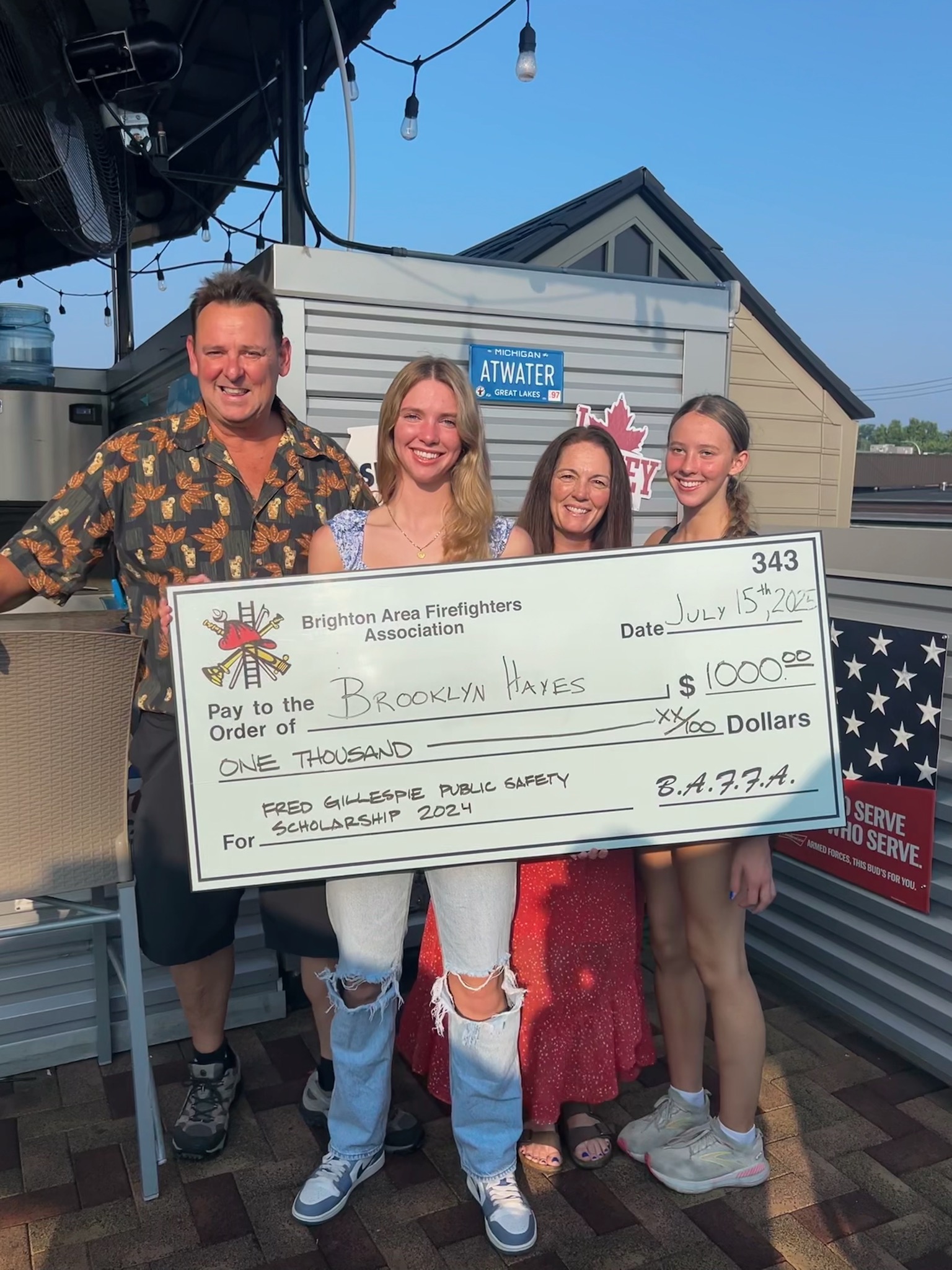 Taylin Lewallin receiving the Brighton Area Firefighters Association Fred Gillespie Public Safety Scholarship 2024